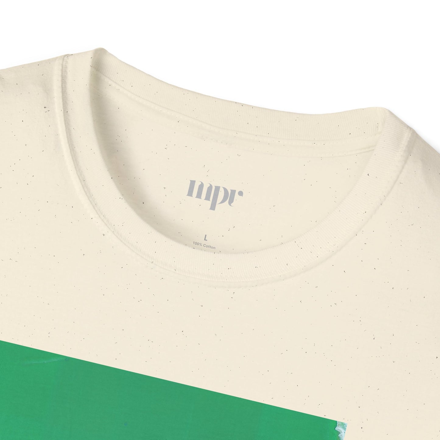 Close-up of a beige t-shirt with a green section and 'nupr' branding on a white background