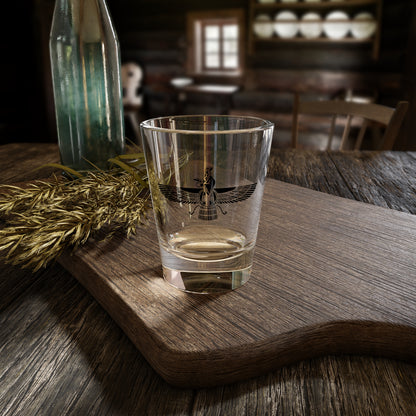 Clear glass with a black design of a Darvish doing Sama dance on a wooden tray in a rustic setting