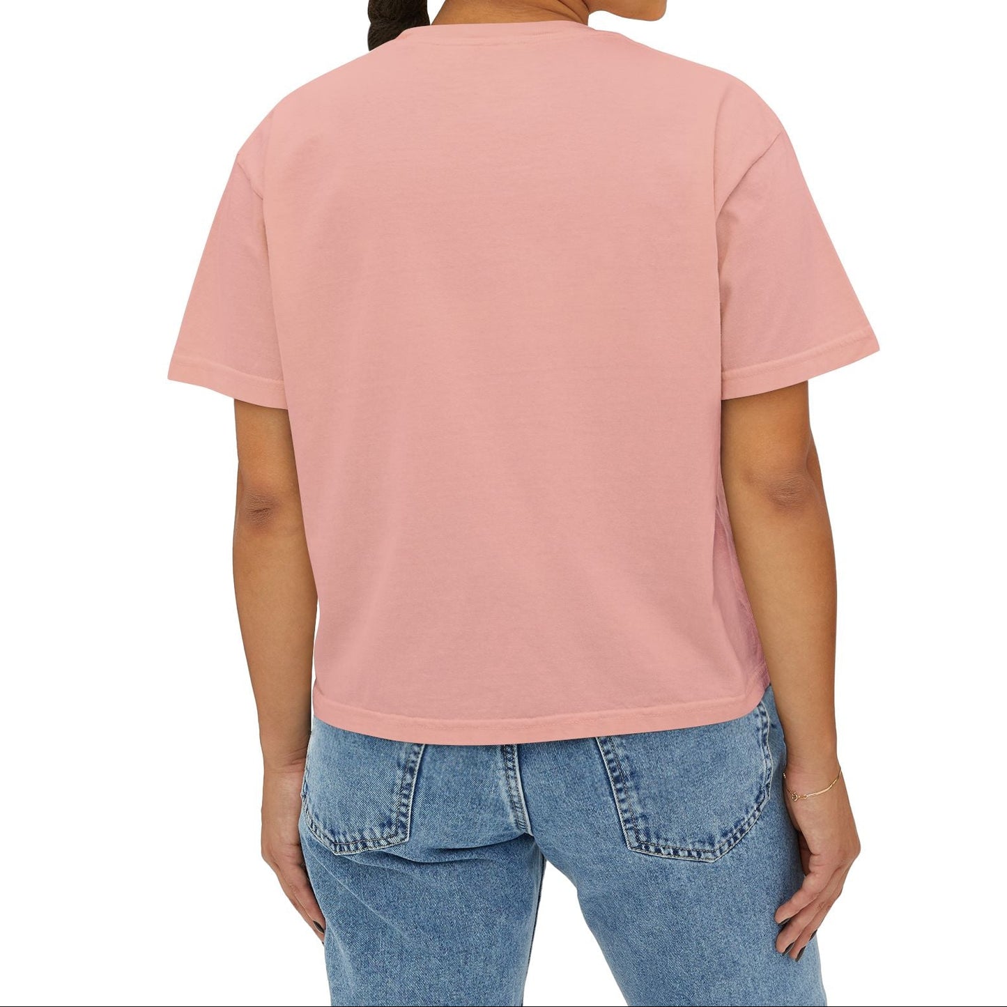 Woman wearing a pink t-shirt and blue jeans on a white background