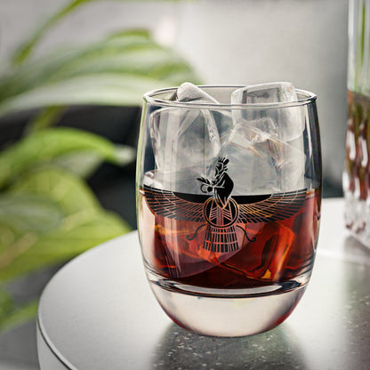Clear wine glass with a black design of a Farvahar symbol on it. 