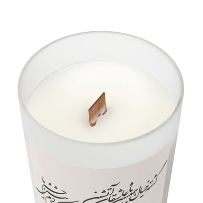 White candle with farsi text on a white background