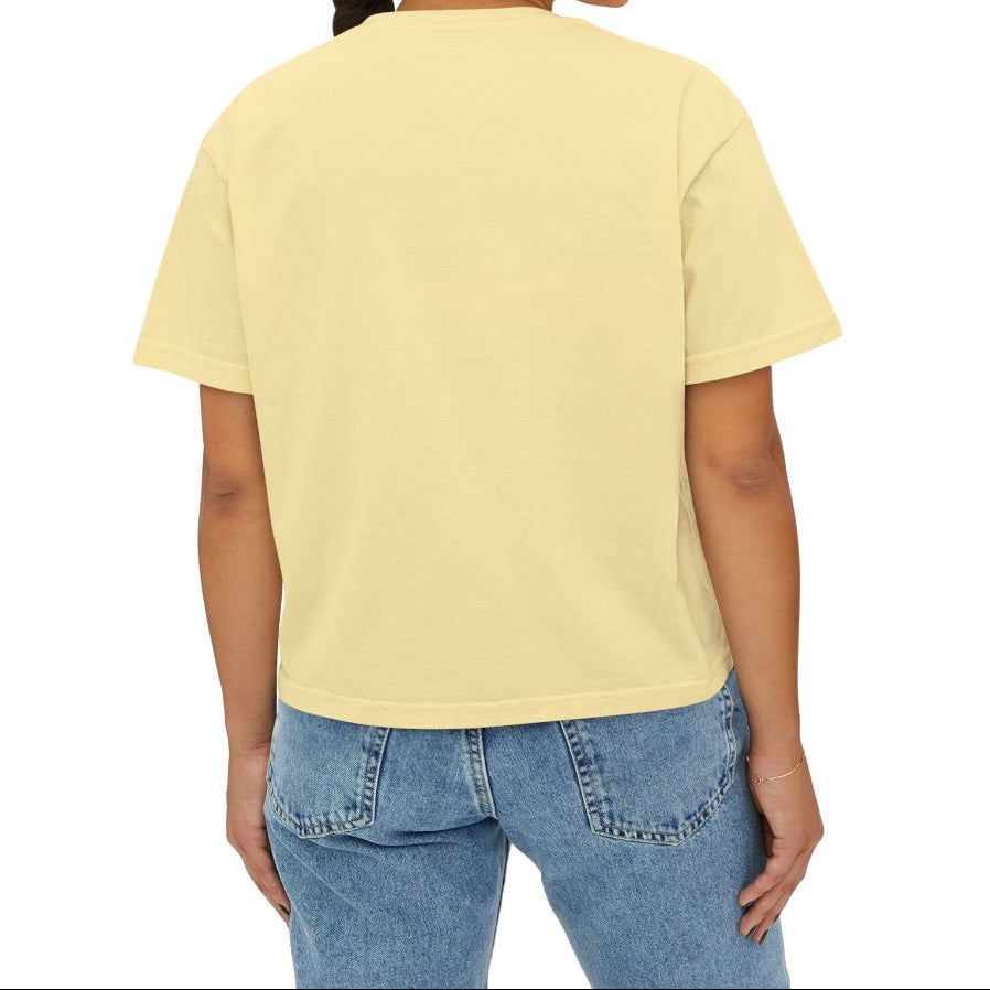 Woman wearing a yellow t-shirt and blue jeans on a white background