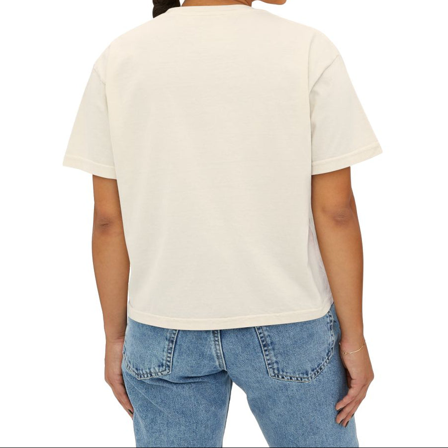 Woman wearing a plain white t-shirt and blue jeans on a white background
