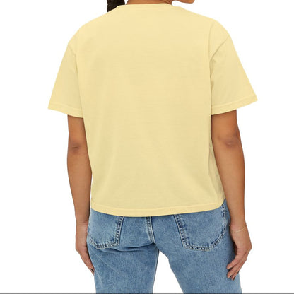 Woman wearing a yellow t-shirt and blue jeans on a white background