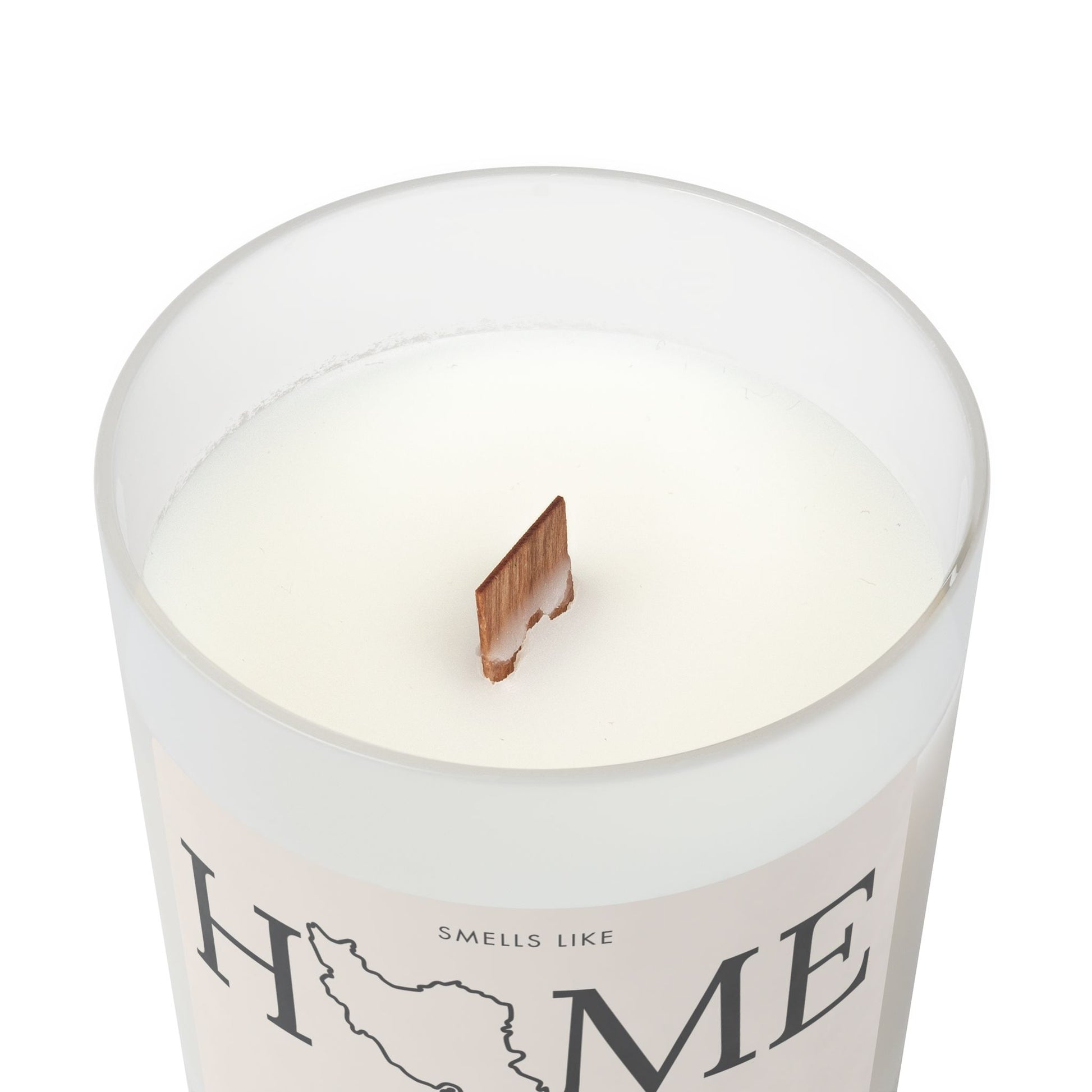 Candle in a container with 'Home' text on a white background
