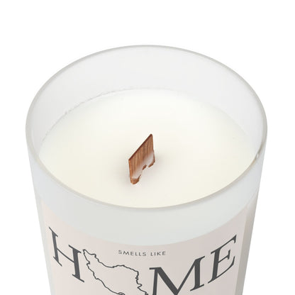 Candle in a container with 'Home' text on a white background