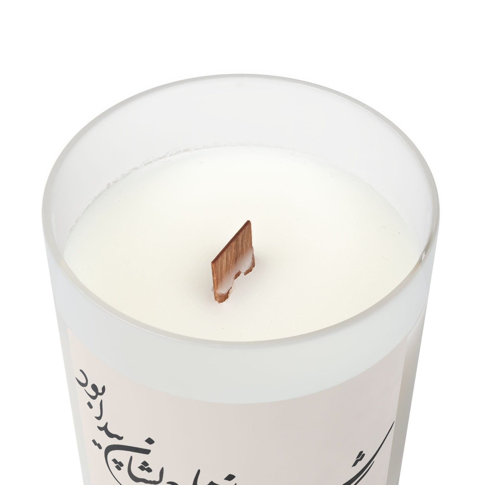 White candle with a wooden wick on a white background