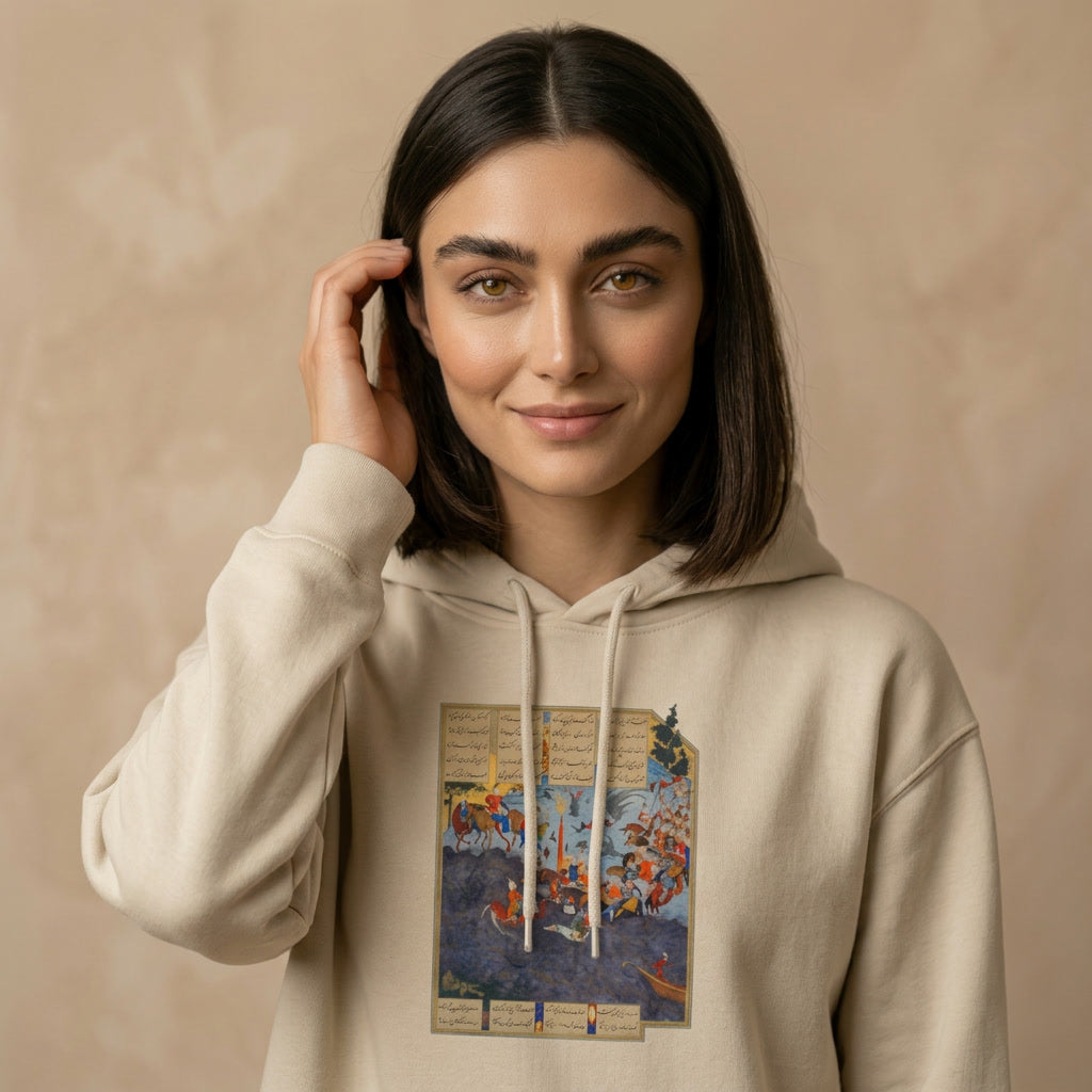 A woman wearing a beige hoodie with a graphic of Shahnameh 