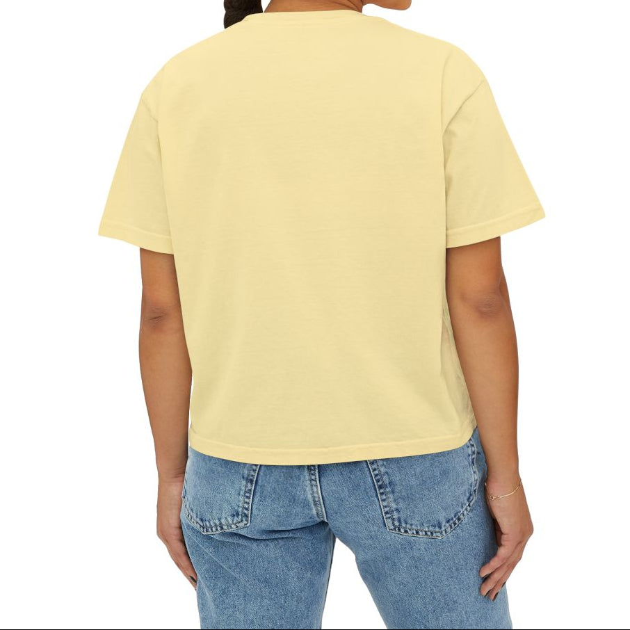 Woman wearing a yellow t-shirt and blue jeans on a white background