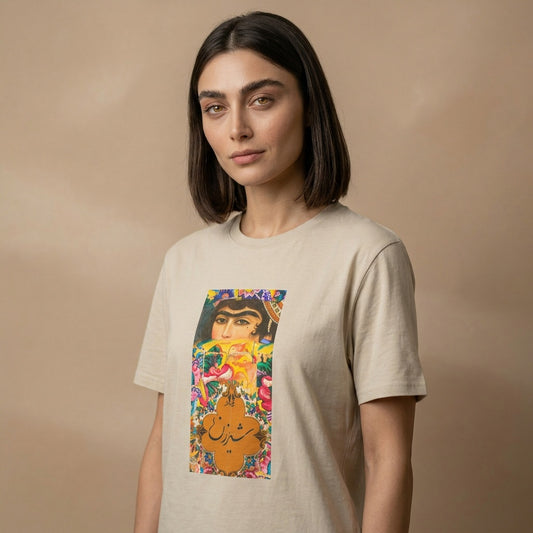 Woman wearing a beige t-shirt with a colorful graphic design of a qajar woman and farsi calligraphy on a beige background