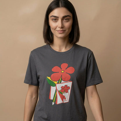 Woman wearing a dark gray t-shirt with a graphic design of red flowers on a beige background